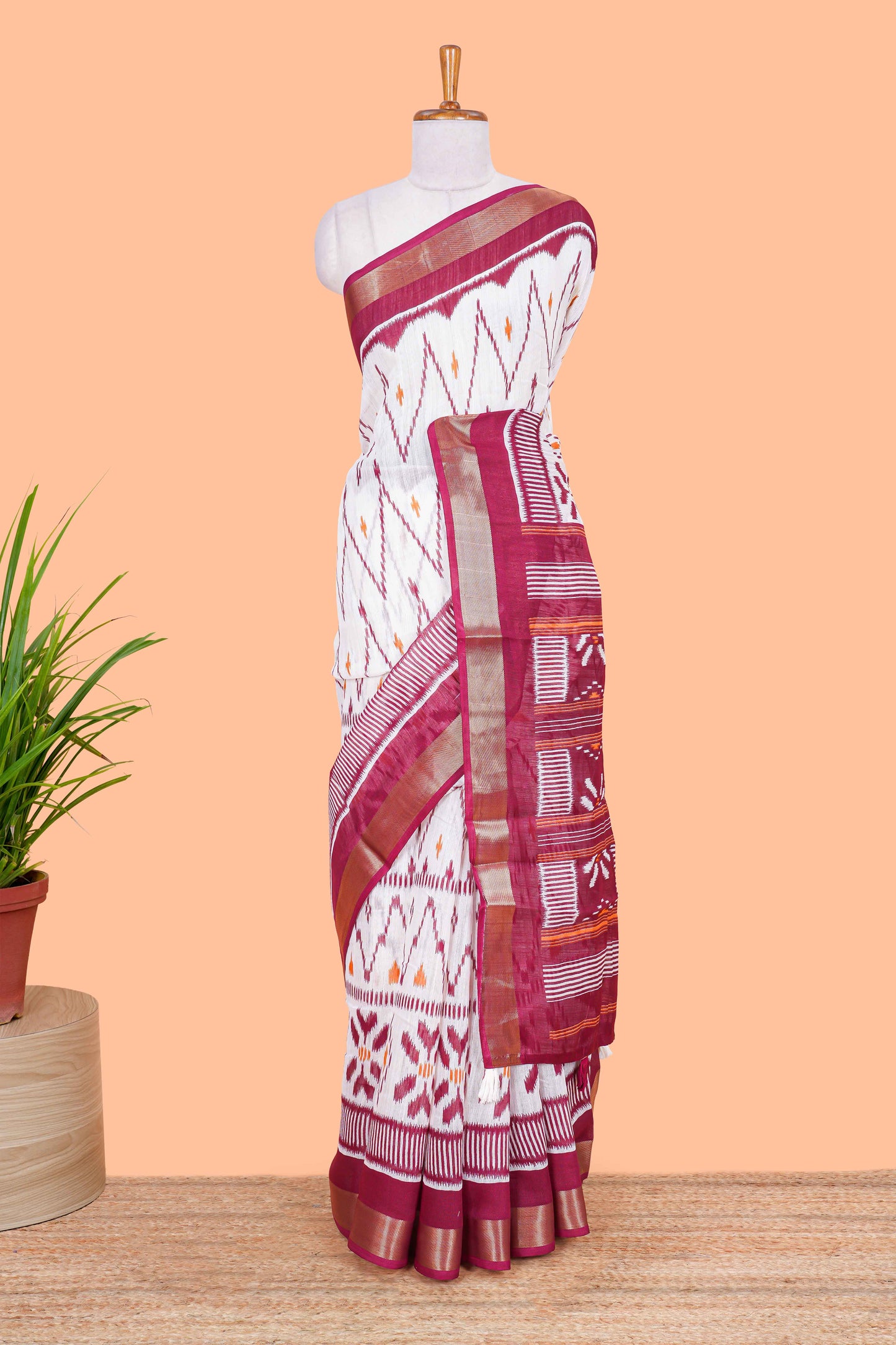 White geomentric ikkat style linen cotton saree with contrast border and pallu