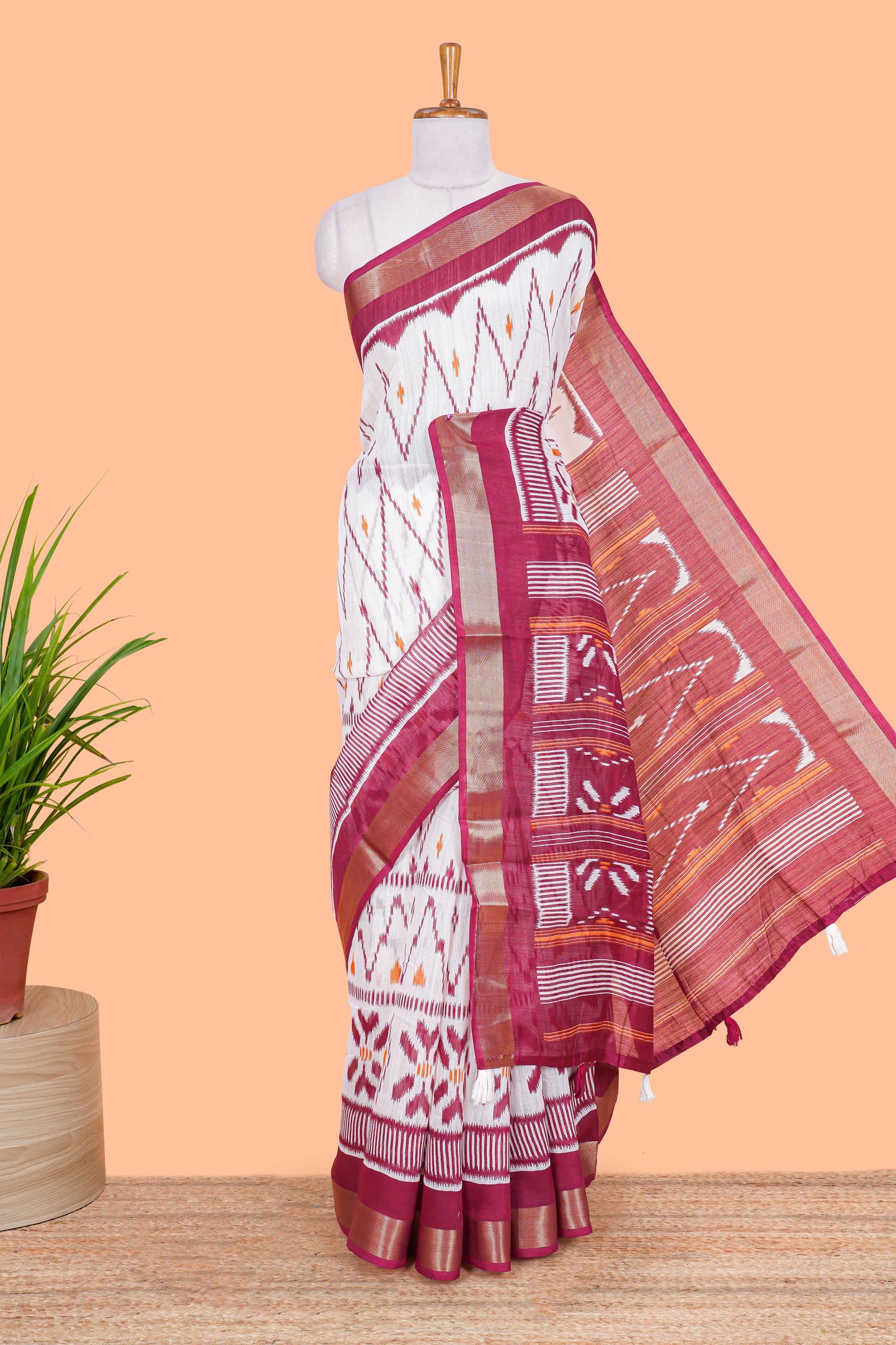 White geomentric ikkat style linen cotton saree with contrast border and pallu