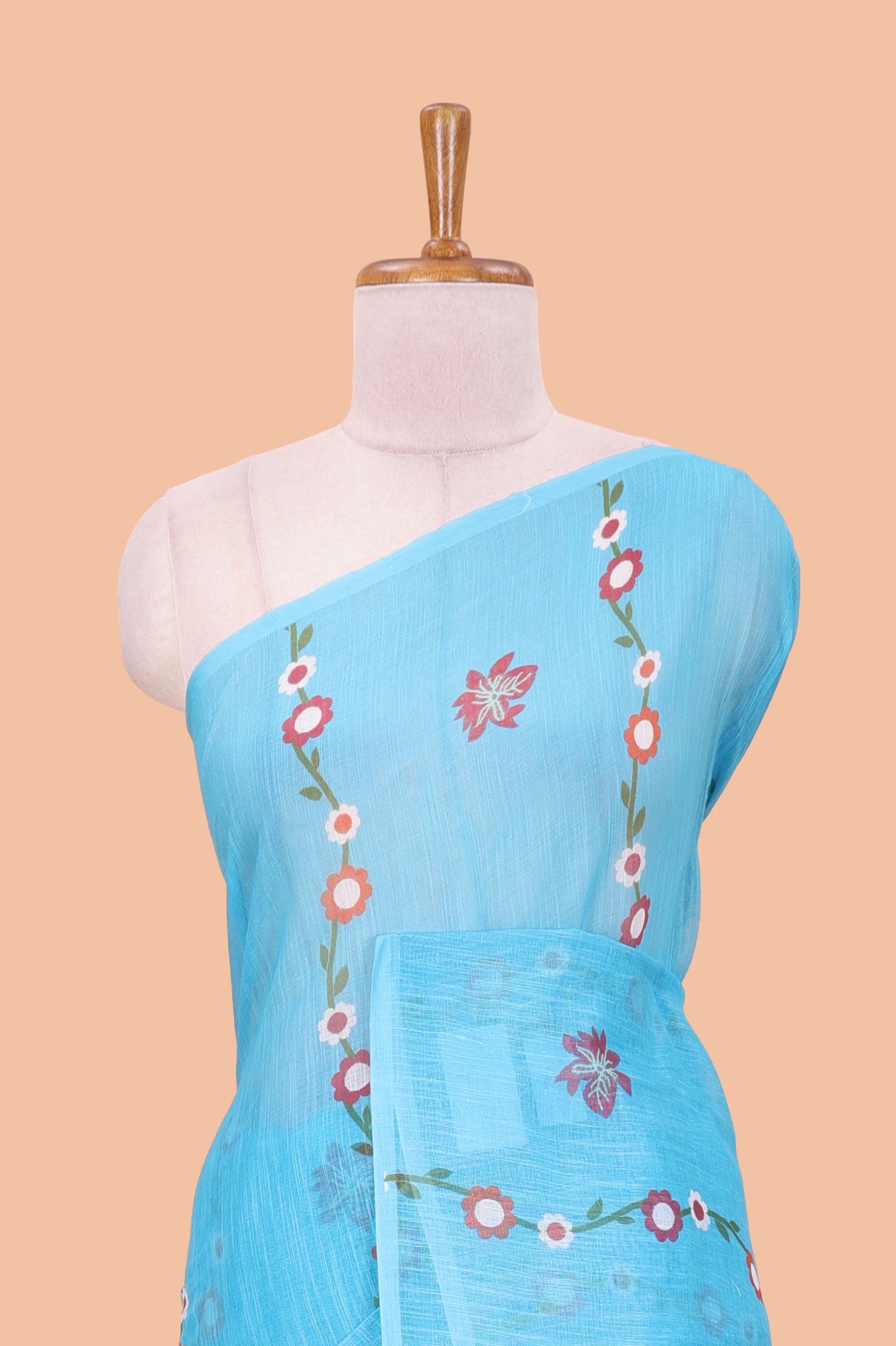 Borderless blue linen saree with floral design, printed pallu and blouse