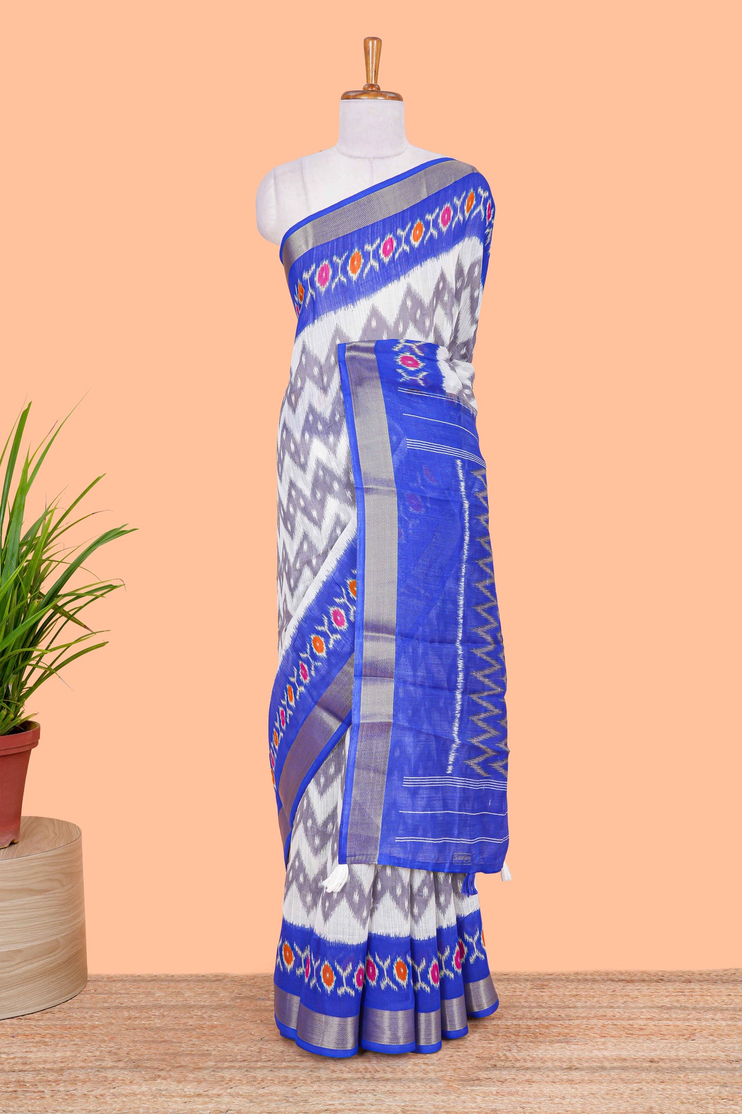 Off white geomentric ikkat style linen cotton saree with contrast border and pallu