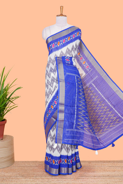 Off white geomentric ikkat style linen cotton saree with contrast border and pallu
