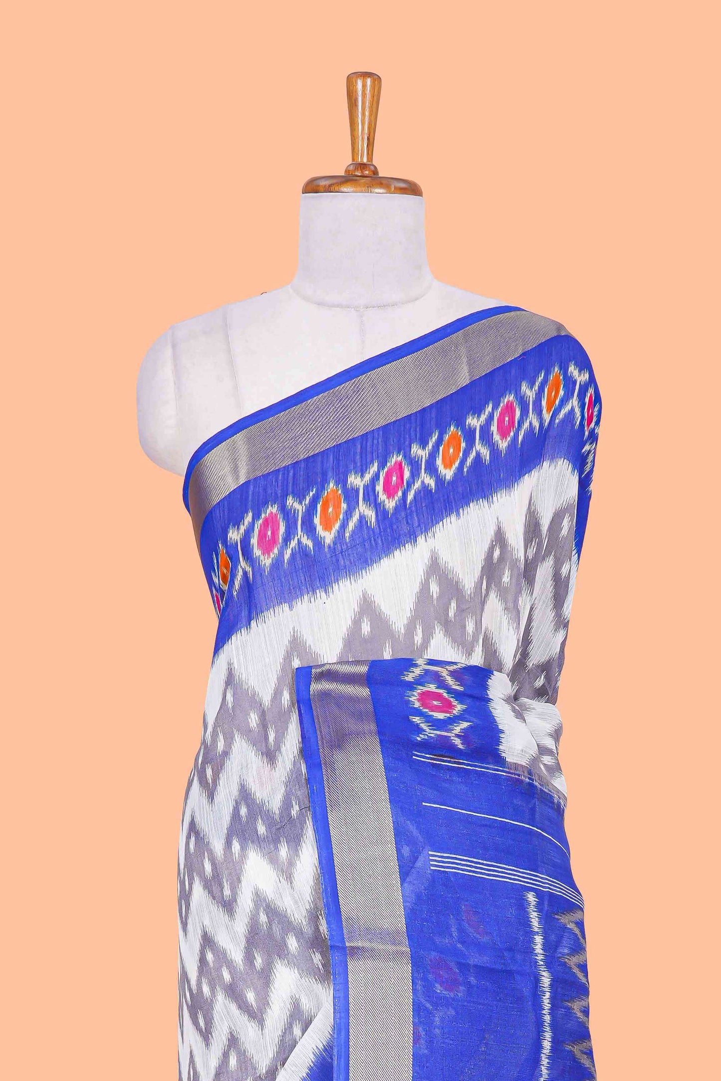 Off white geomentric ikkat style linen cotton saree with contrast border and pallu