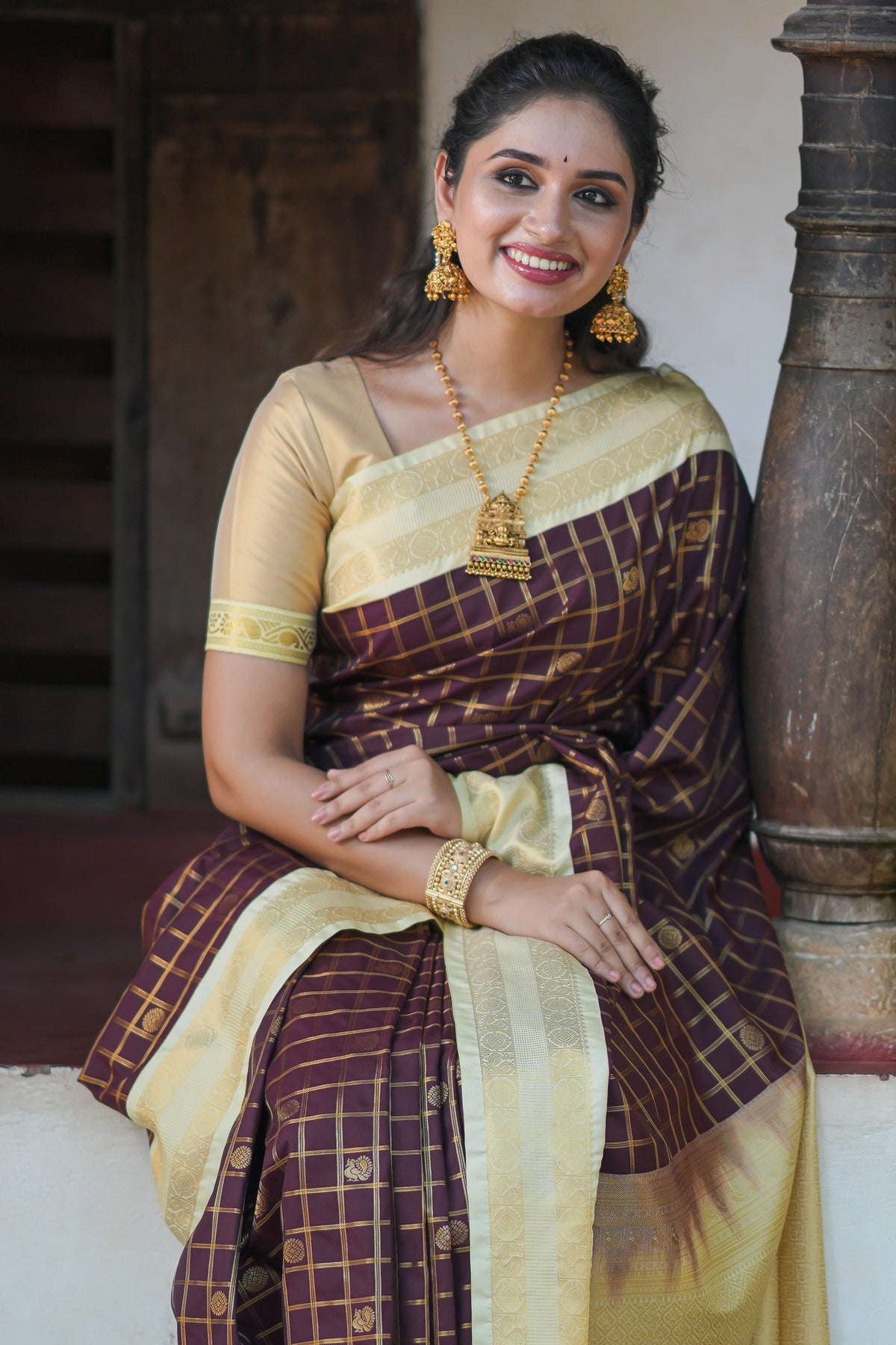 Brown checked art silk saree with contrast zari border and blouse