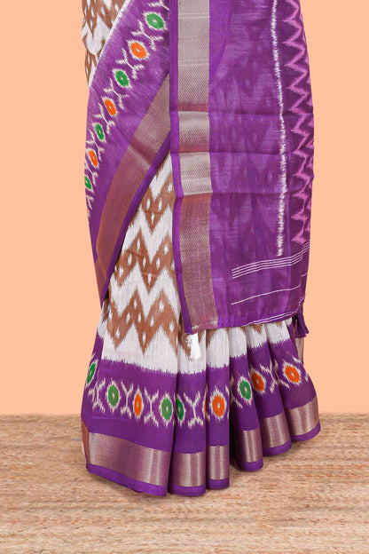 White geomentric ikkat style linen cotton saree with contrast purple border and pallu