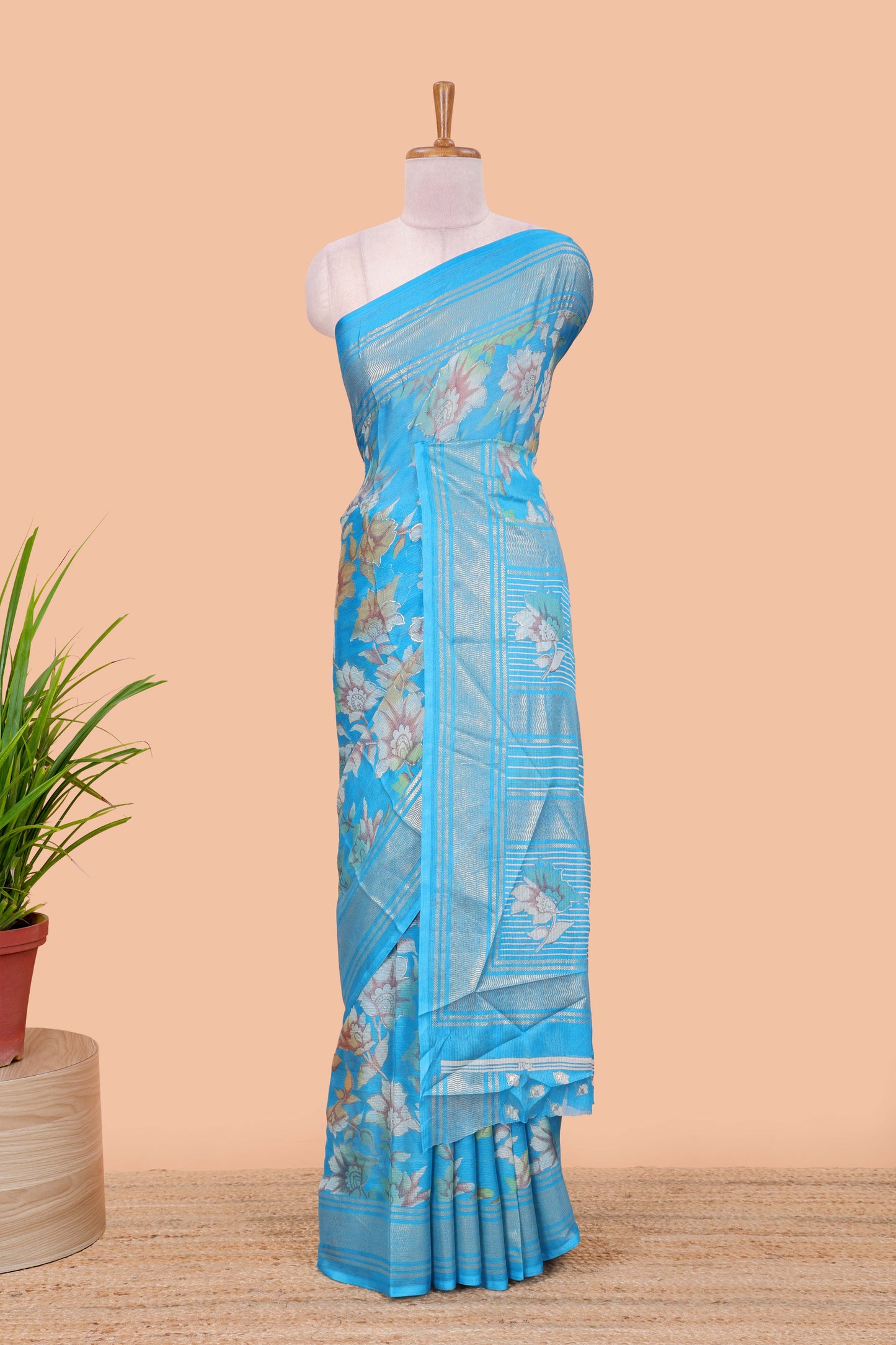 Blue moss chiffon floral print saree with gold zari border and pallu