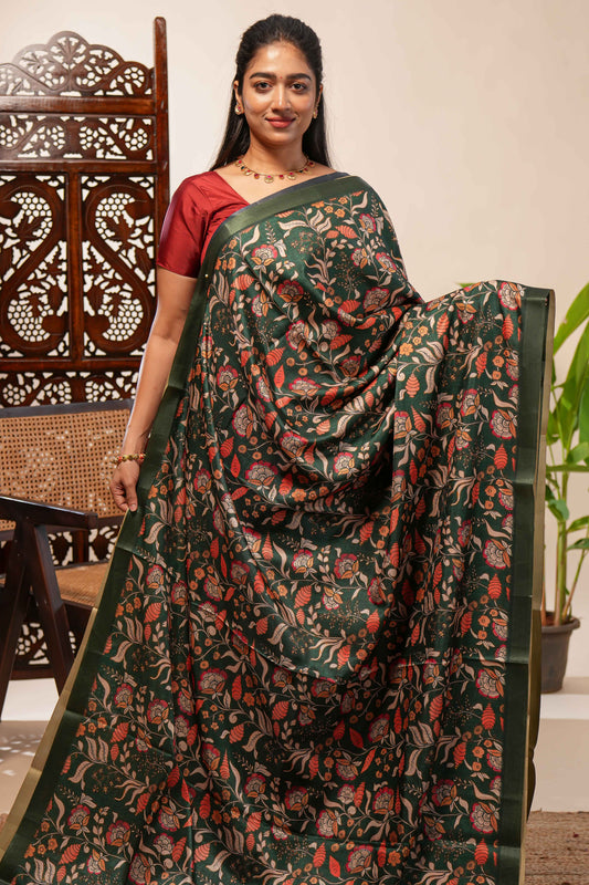 Green floral design tussar saree with self zari border and matching blouse
