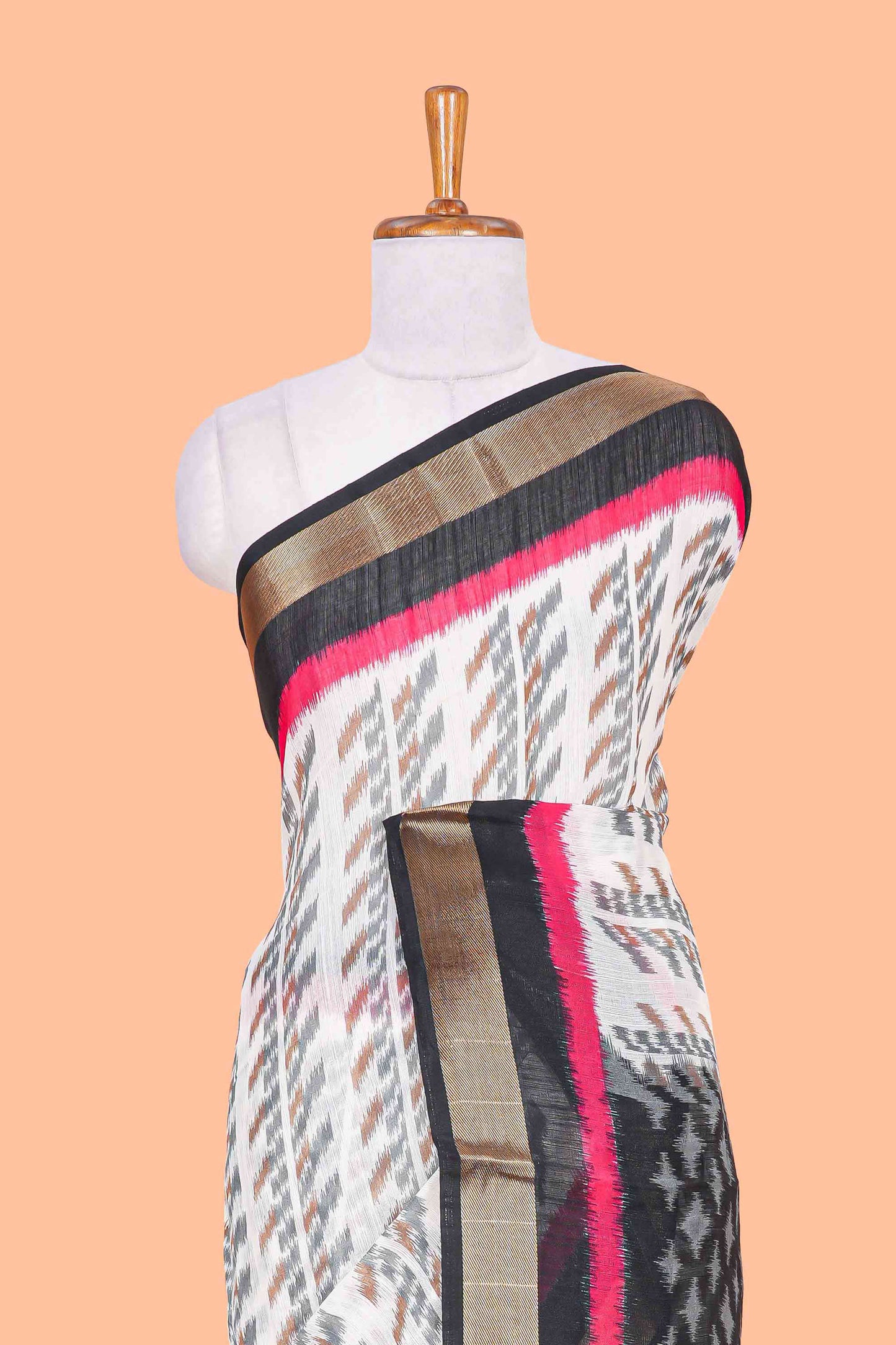 White geomentric ikkat style linen cotton saree with contrast black border and pallu