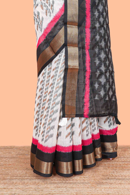 White geomentric ikkat style linen cotton saree with contrast black border and pallu