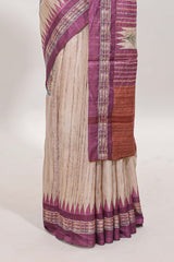 Tussar saree in beige tone delicate floral embroidery featuring violet borders and woven pallu along with contrast blouse