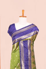 Green Semi Art Silk Saree Delicate Golden Zari Motifs Along With Thalampoo Zari Woven Across The Body. The Border Is Broad With Intricate Floral Zari Weaving Rich Golden Zari Pallu