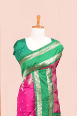 Pink Semi Art Silk Saree Delicate Golden Zari Motifs Along With Thalampoo Zari Woven Across The Body. The Border Is Broad With Intricate Floral Zari Weaving Rich Golden Zari Pallu