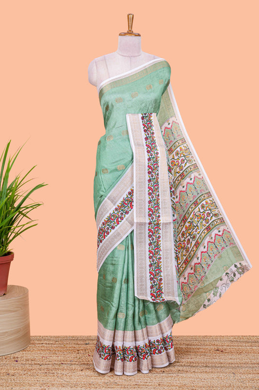 Green peacock zari butta dola silk saree with contrast floral vine border and printed blouse