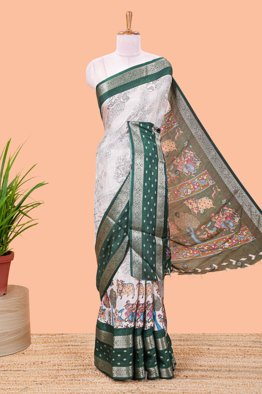 White Kalamkari style floral and crane birds print marsh georgette saree with green zari border and printed pallu