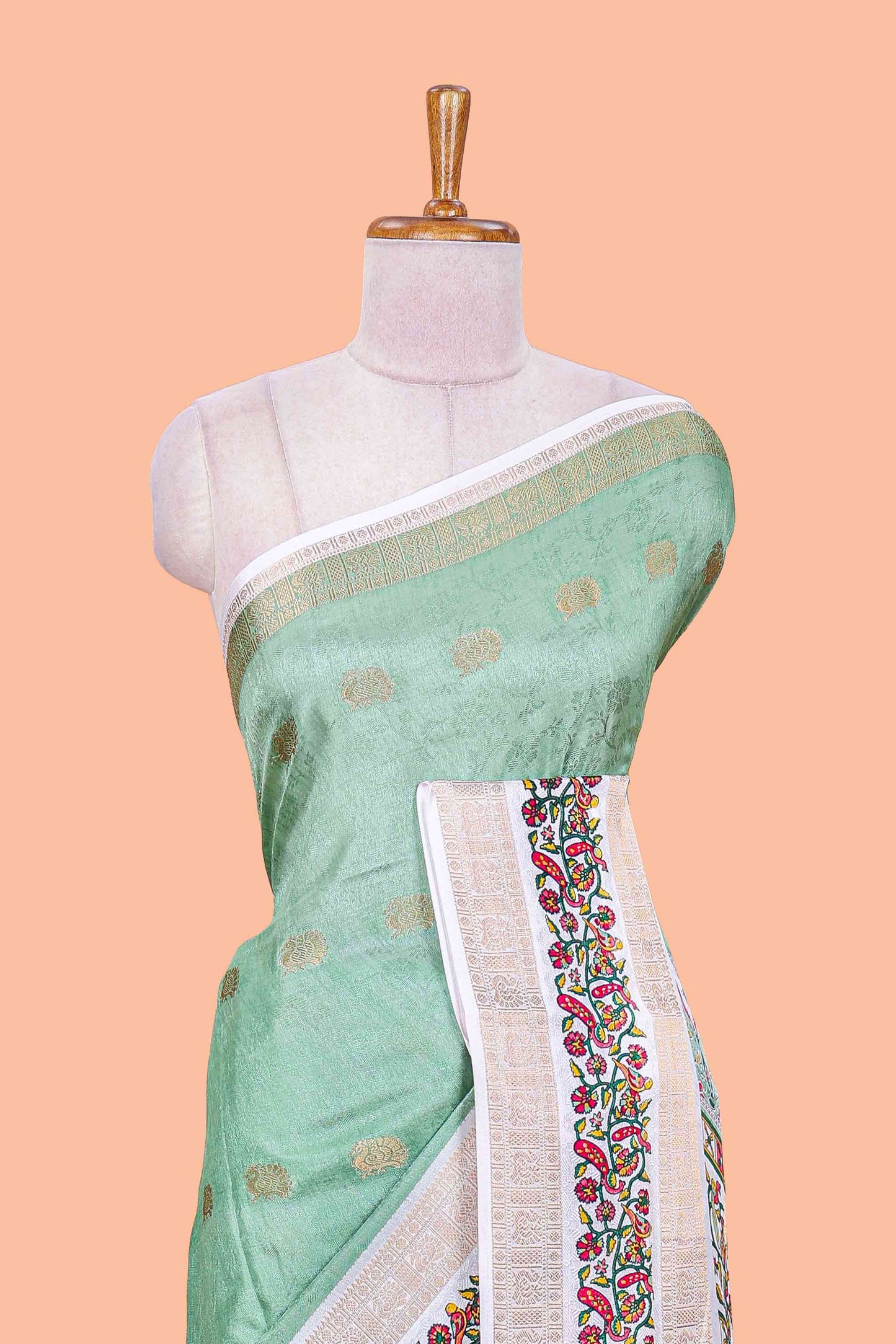 Green peacock zari butta dola silk saree with contrast floral vine border and printed blouse