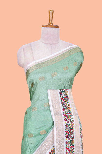 Green peacock zari butta dola silk saree with contrast floral vine border and printed blouse