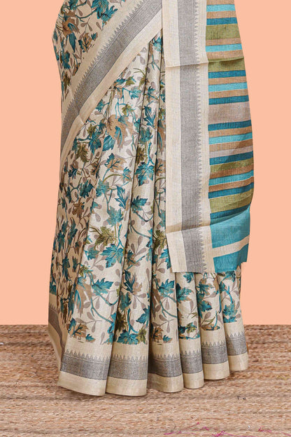Beige south cotton saree featuring all over floral prints on the body and pallu