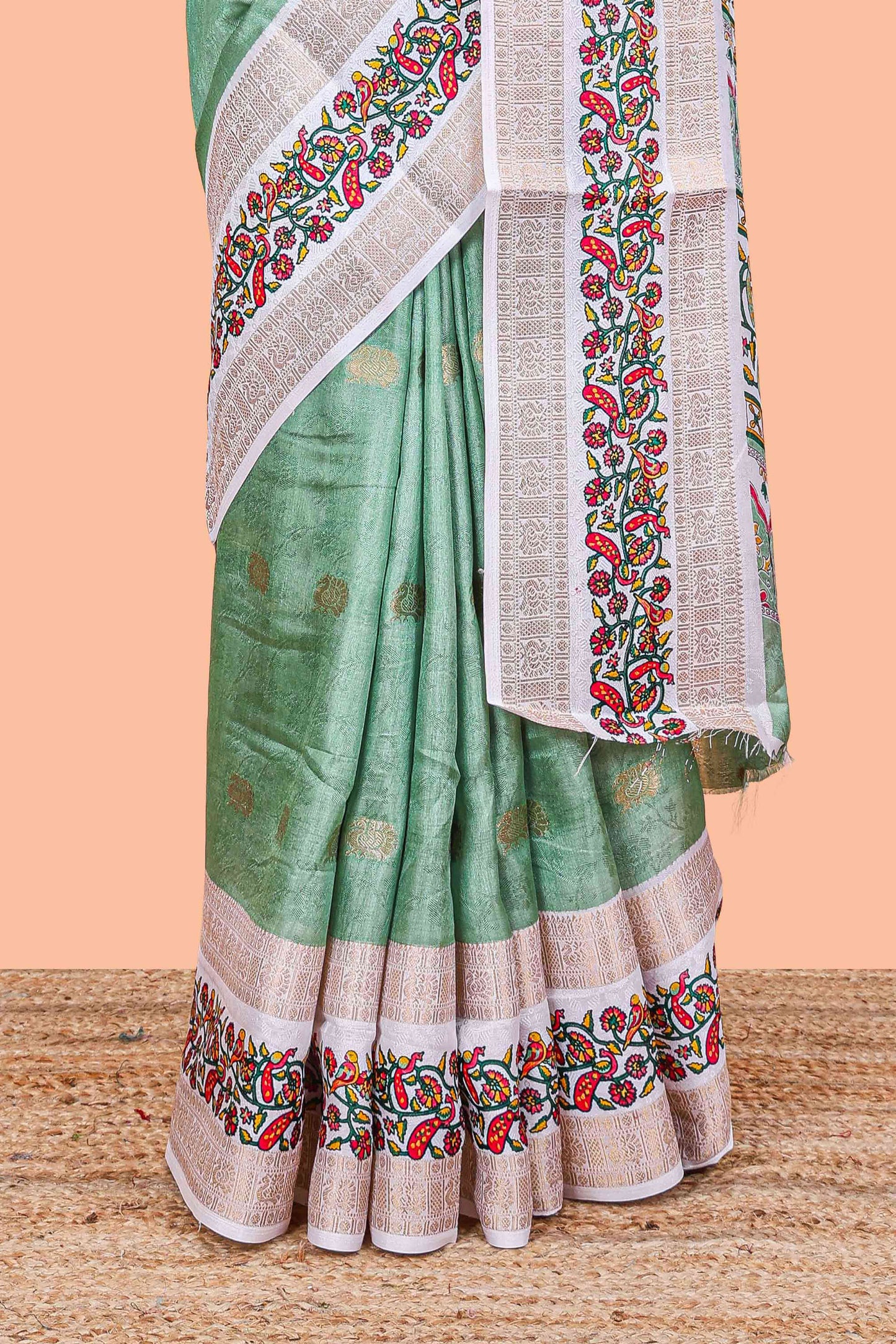 Green peacock zari butta dola silk saree with contrast floral vine border and printed blouse