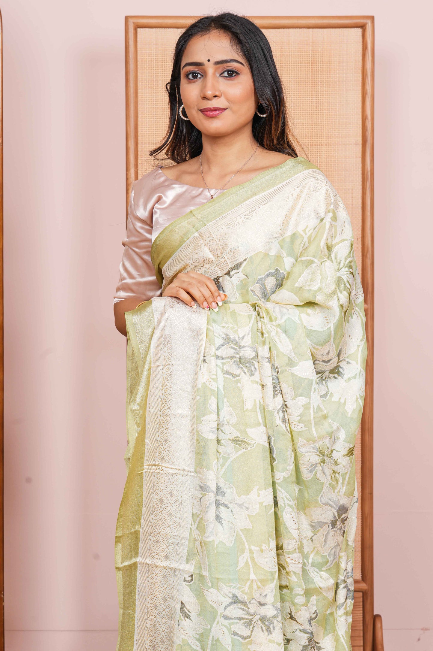 light green saree with a floral pattern 