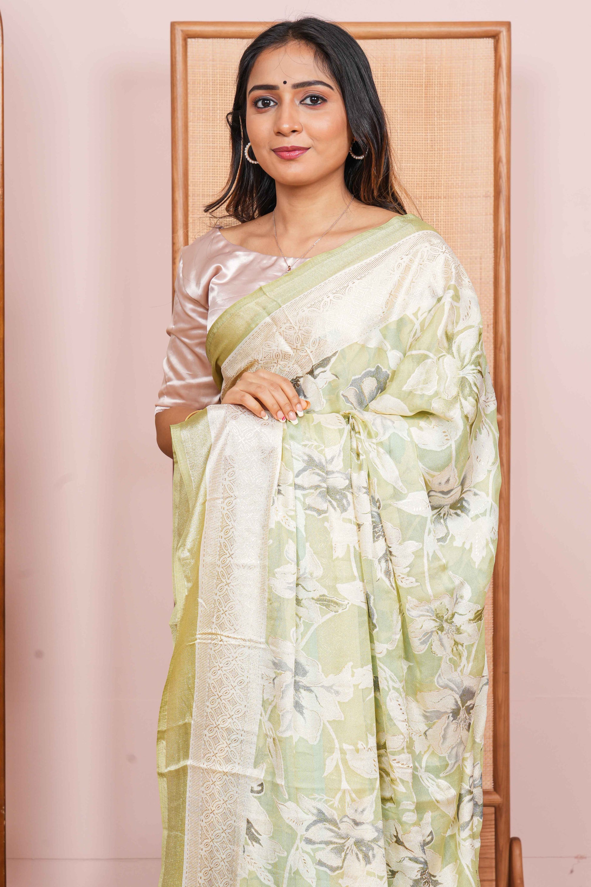 light green saree with a floral pattern 