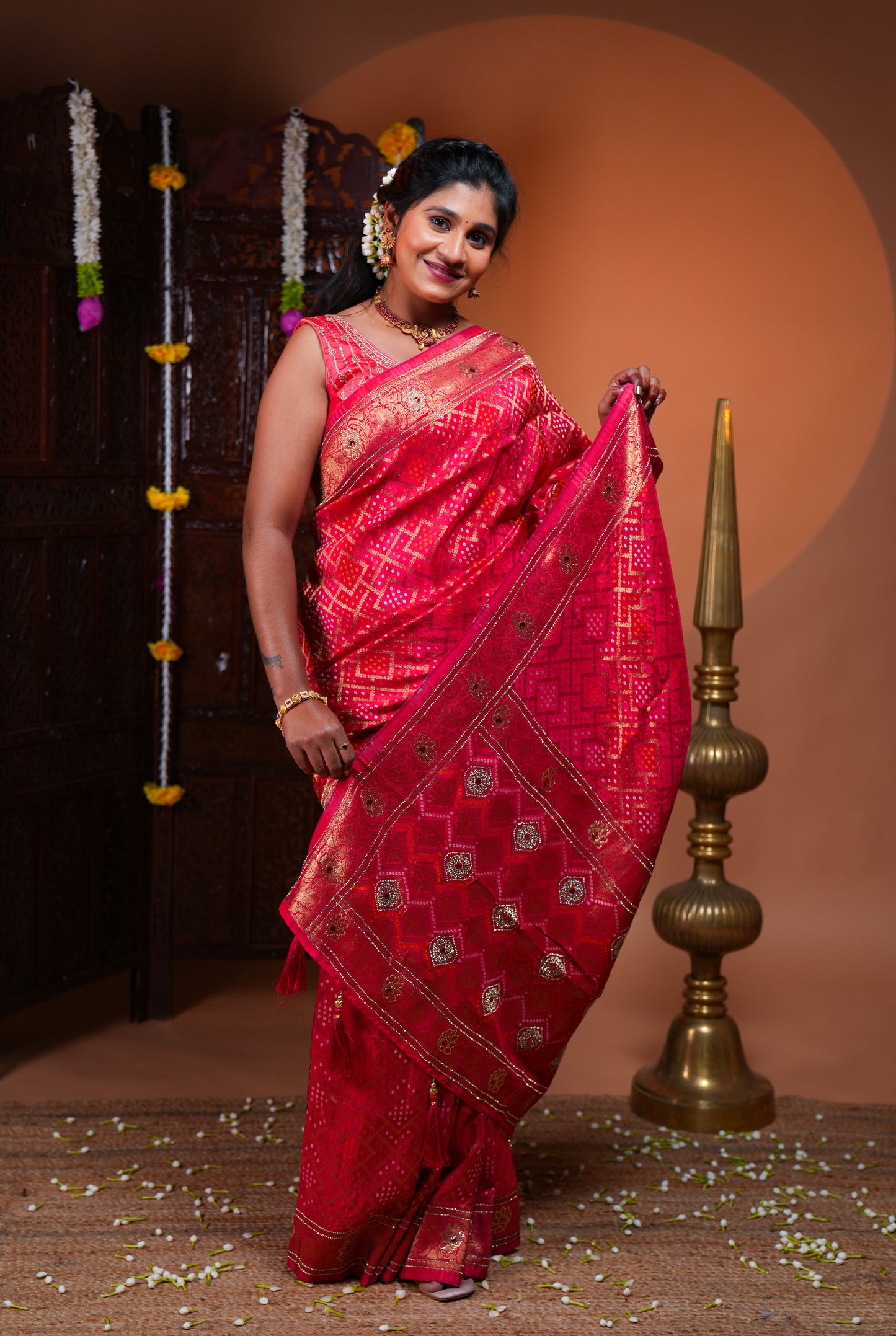 Rani pink bandhani style georgette saree with self stone work design border and pallu