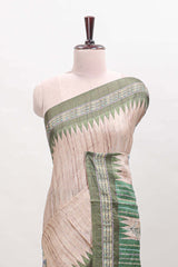 Tussar saree in beige tone delicate floral embroidery featuring dark green borders and woven pallu along with contrast blouse