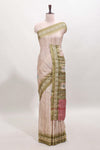 Tussar saree in beige tone delicate floral embroidery featuring green borders and woven pallu along with contrast blouse