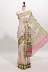Tussar saree in beige tone delicate floral embroidery featuring green borders and woven pallu along with contrast blouse