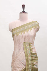 Tussar saree in beige tone delicate floral embroidery featuring green borders and woven pallu along with contrast blouse