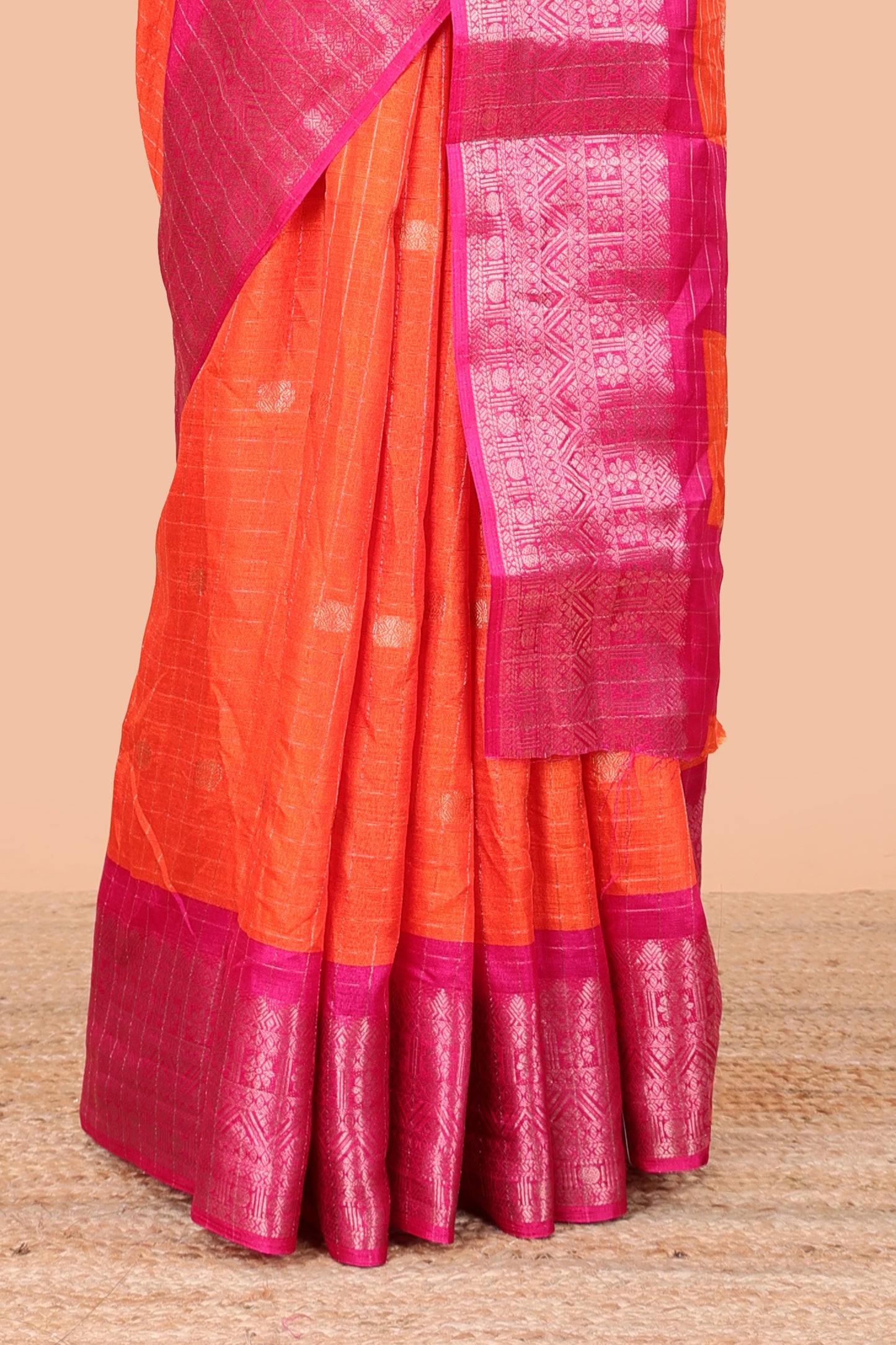Red viscose dola silk saree with all over checked butta design, contrast zari border and pallu