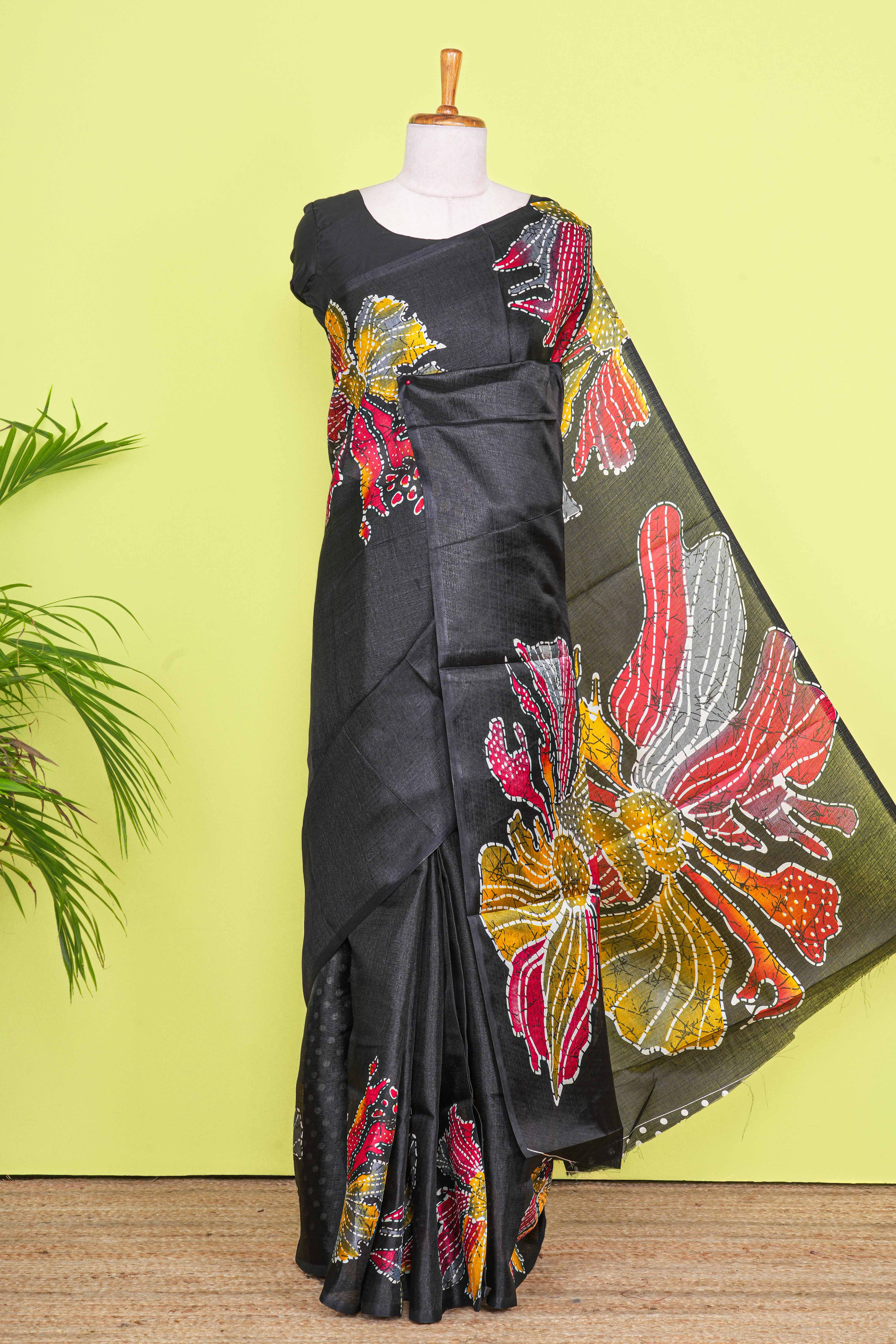 Black south cotton Saree With Multi Color Orchid Printed Across The Body Along With White Dotted Blouse