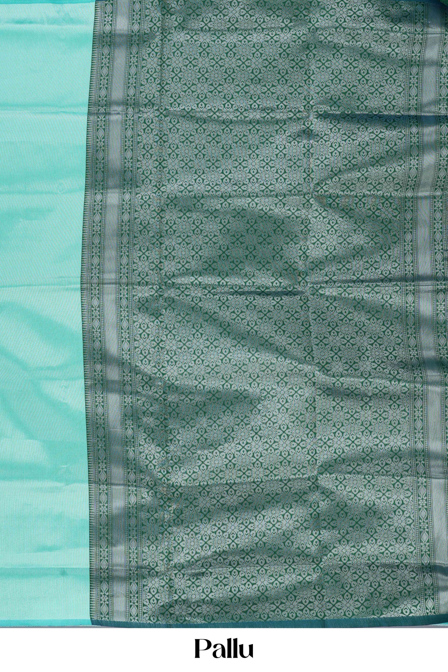 Teal  green lichi silk saree with a patterned pallu on a light blue background 