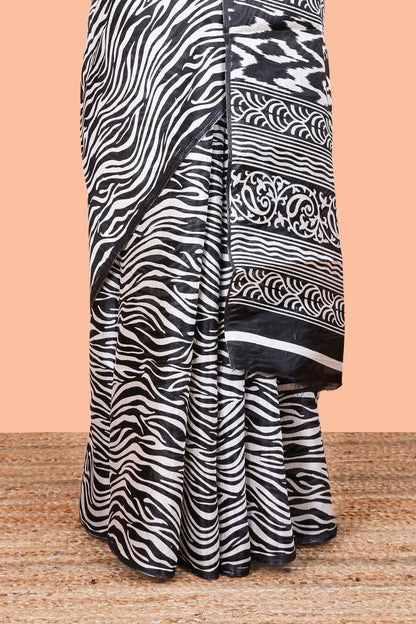 khadi cotton saree with zebra print all over body and pallu along with contrast blouse