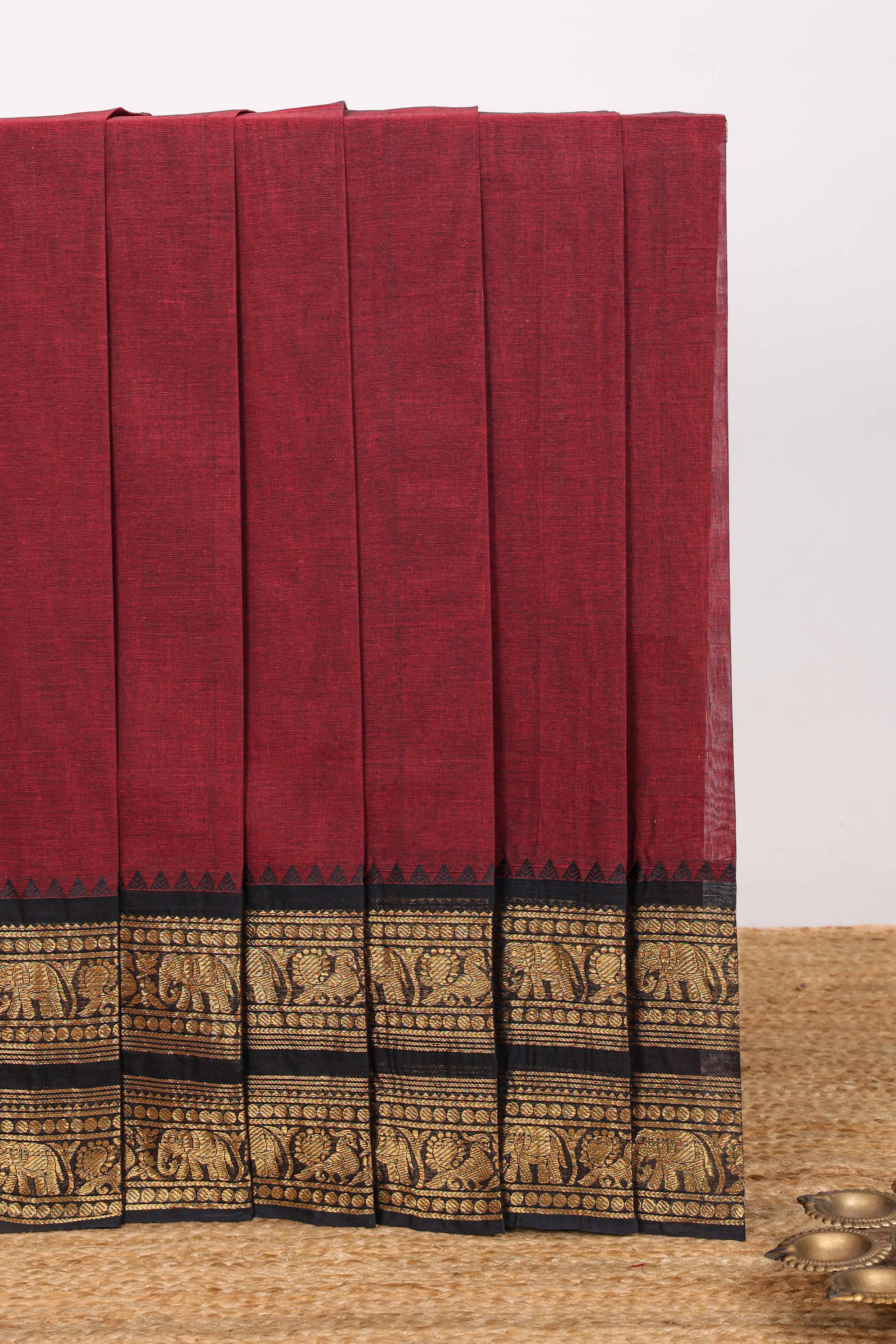 Red plain chettinad cotton saree with contrast zari border and matching blouse