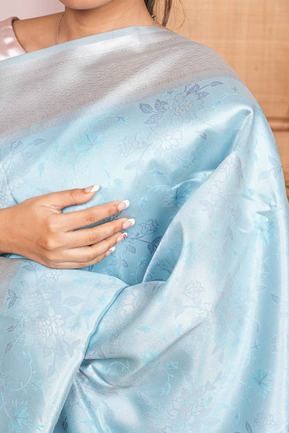 Light blue tissue  fabric with floral patterns 