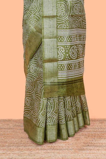 Green south cotton saree with bandhini print body & pallu and silver bawanchi border