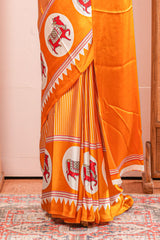 Vibrant Yellow Modal Silk Saree The Body Has Fine Vertical White Stripes The Border Are Highlighted Pichwai Design Along With Ajrakh Printed Blouse