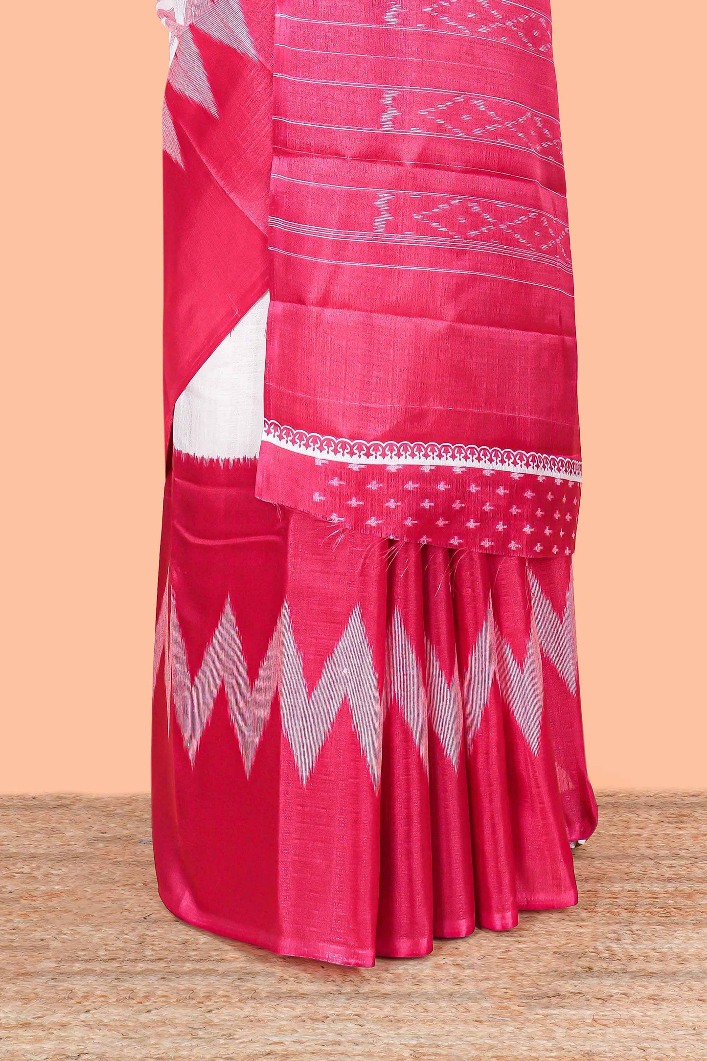 Pink & white geometric ikkat style south cotton saree with striped pallu and blouse