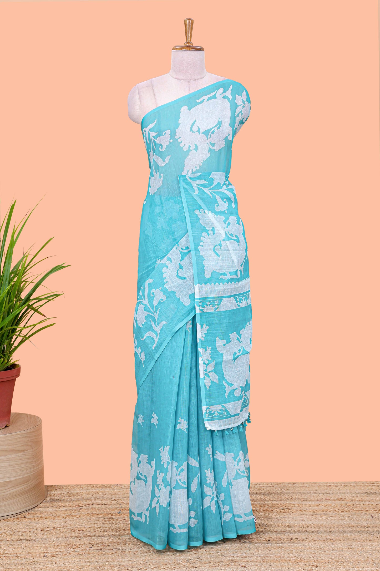 Turquoise green linen cotton floral and birds print saree with self border and matching printed blouse