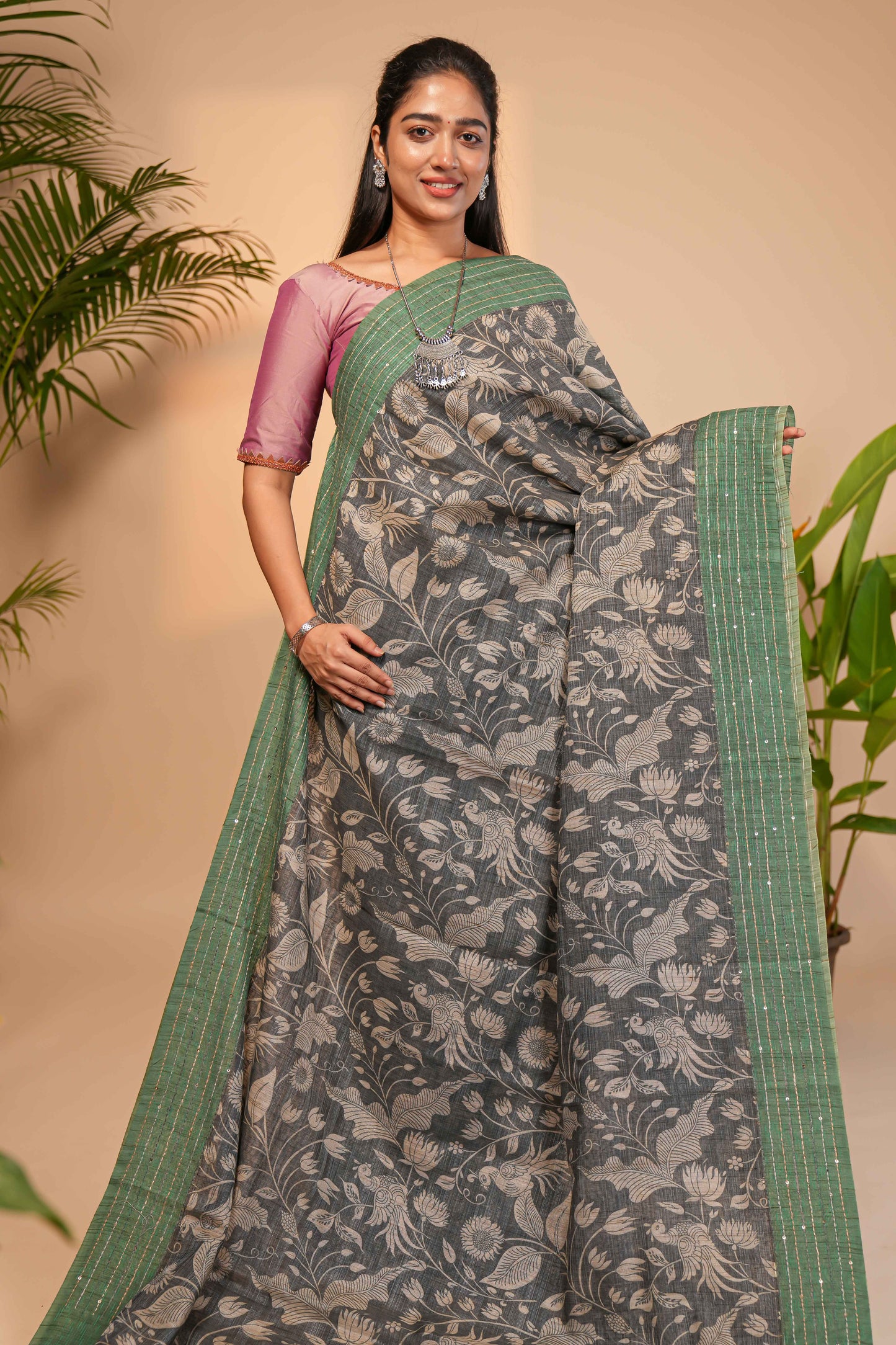 Grey floral design semi tussar saree with contrast green border and printed pallu