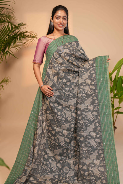 Grey floral design semi tussar saree with contrast green border and printed pallu