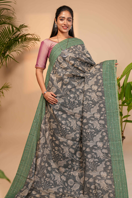 Grey floral design semi tussar saree with contrast green border and printed pallu