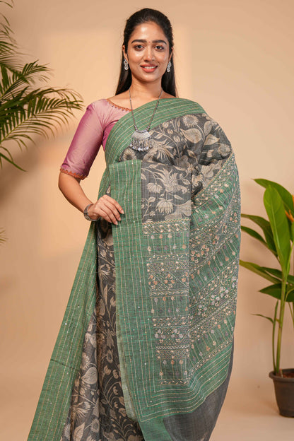 Grey floral design semi tussar saree with contrast green border and printed pallu