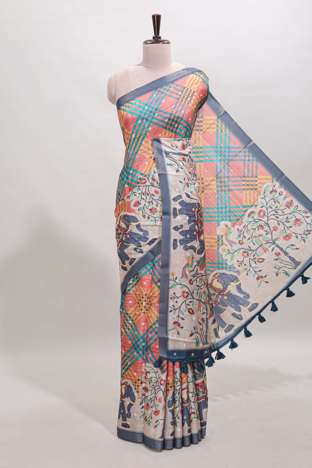 Multicolor Tussar Saree checkered body artistic elephant and floral prints and contrasting border with tassel along with blouse piece