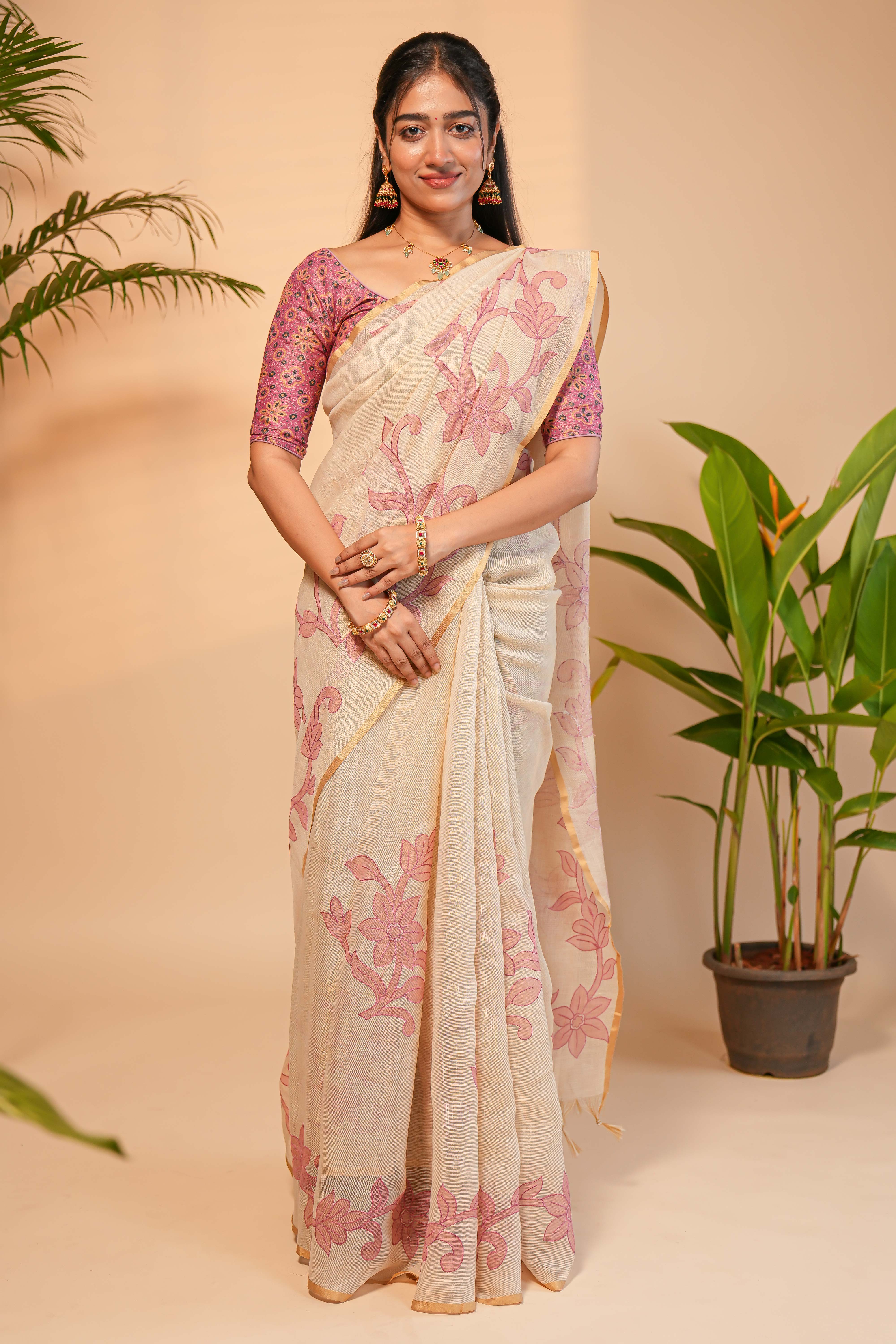 Cream floral design linen cotton saree with self zari border and matching printed blouse