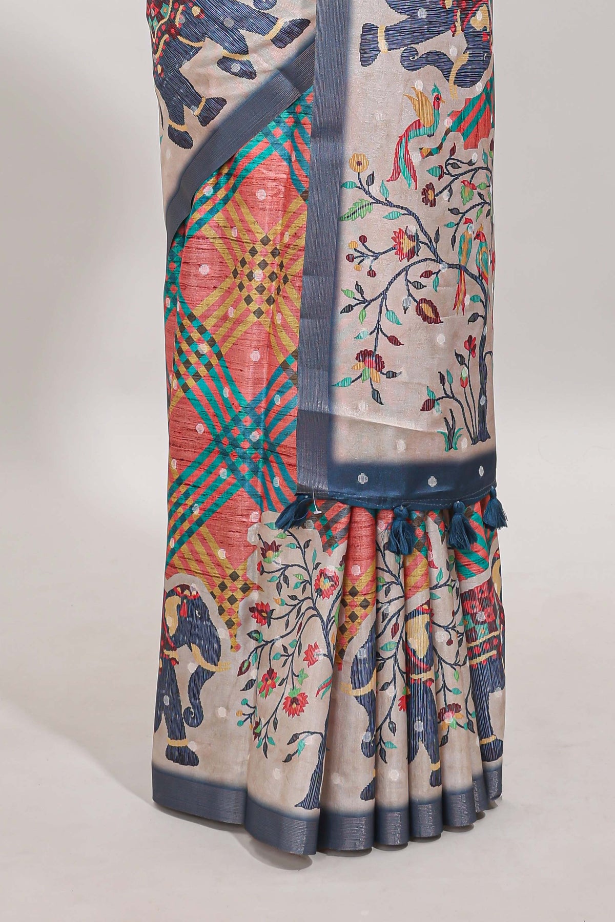 Multicolor Tussar Saree checkered body artistic elephant and floral prints and contrasting border with tassel along with blouse piece