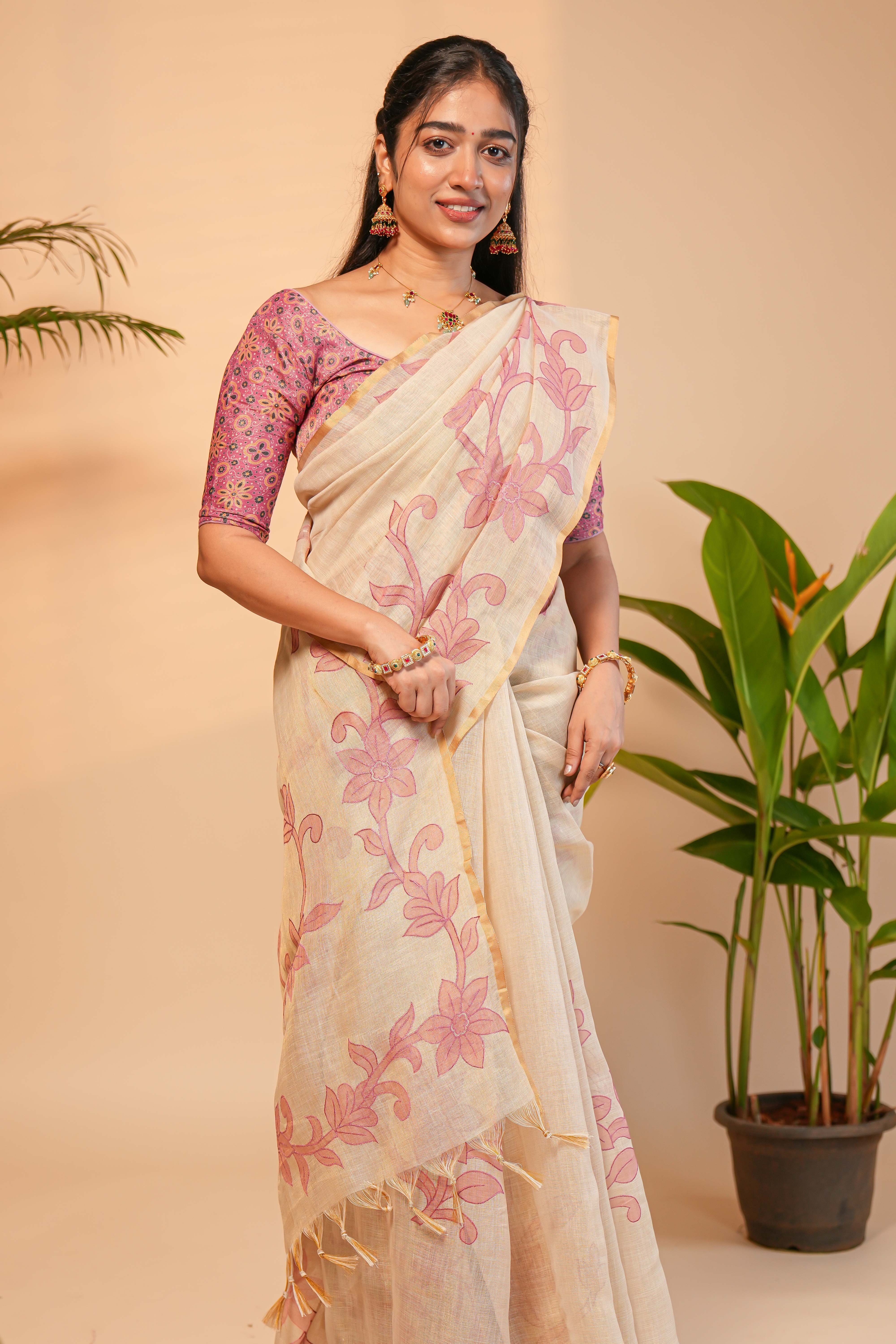 Cream floral design linen cotton saree with self zari border and matching printed blouse