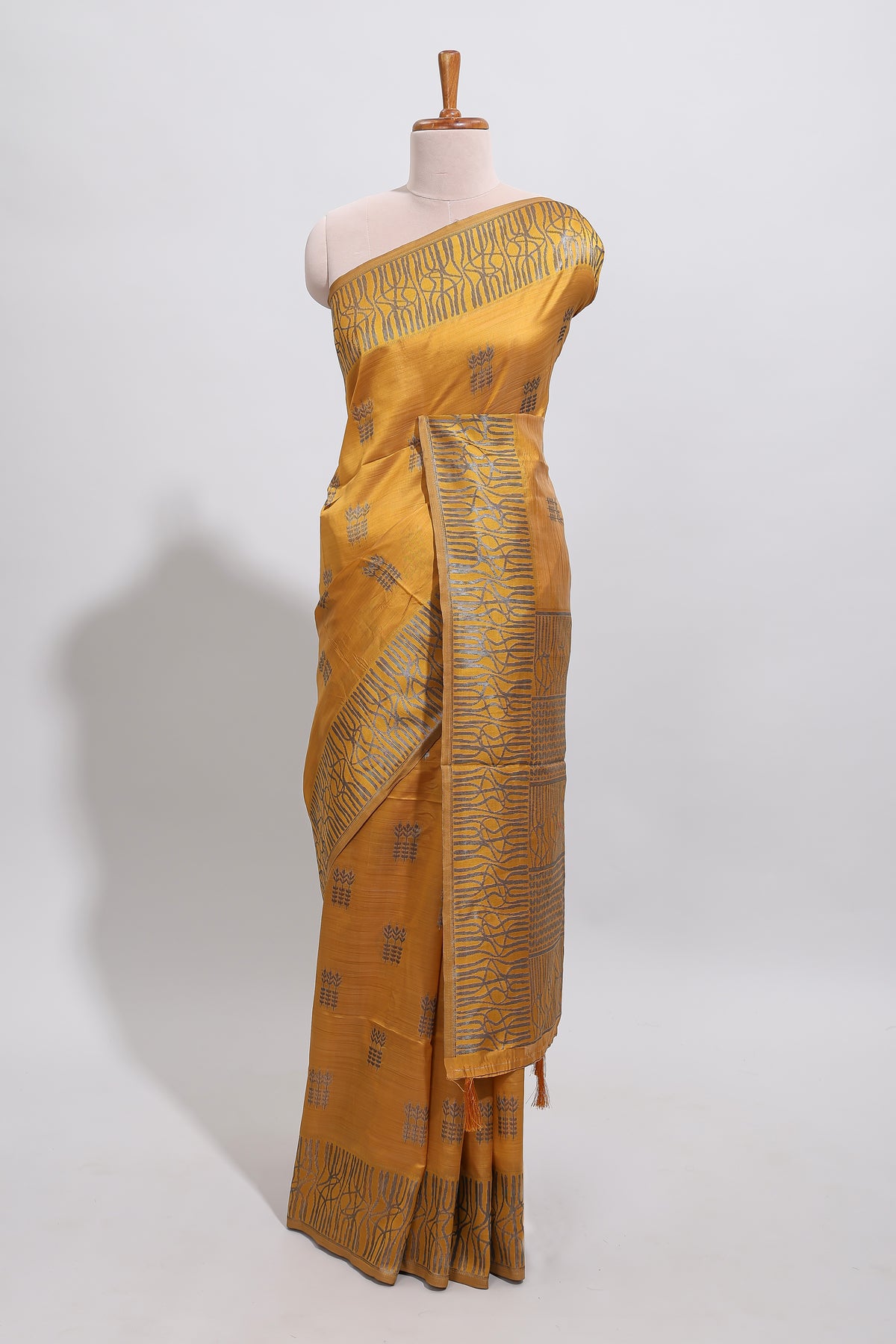 Mustard floral zari motifs design tussar saree with self border matching blouse
