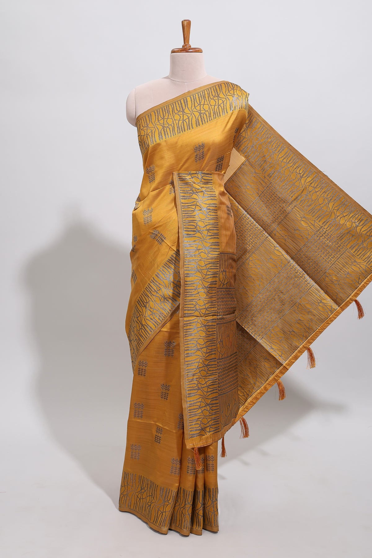 Mustard floral zari motifs design tussar saree with self border matching blouse