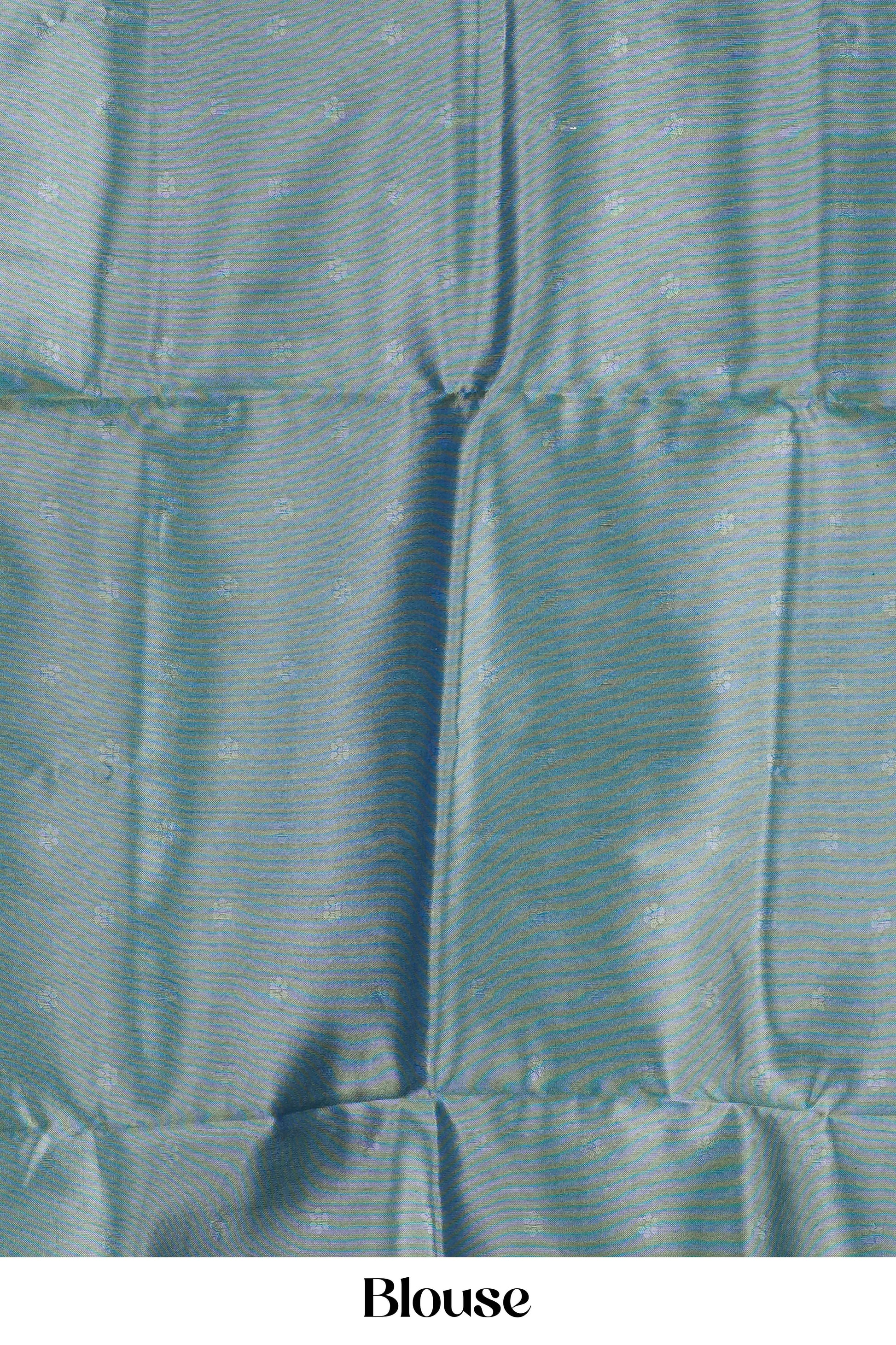 Teal  lichi silk saree blouse with a textured pattern on a plain background
