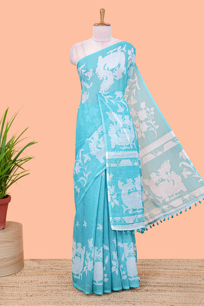 Turquoise green linen cotton floral and birds print saree with self border and matching printed blouse